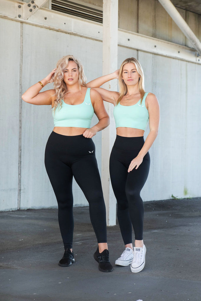 2 blonde models friend wearing sports bra and leggings