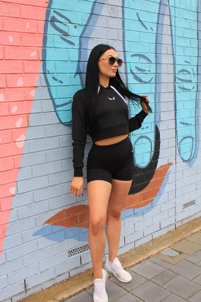 Black hair model. Active wear. Jumper. Bike Shorts