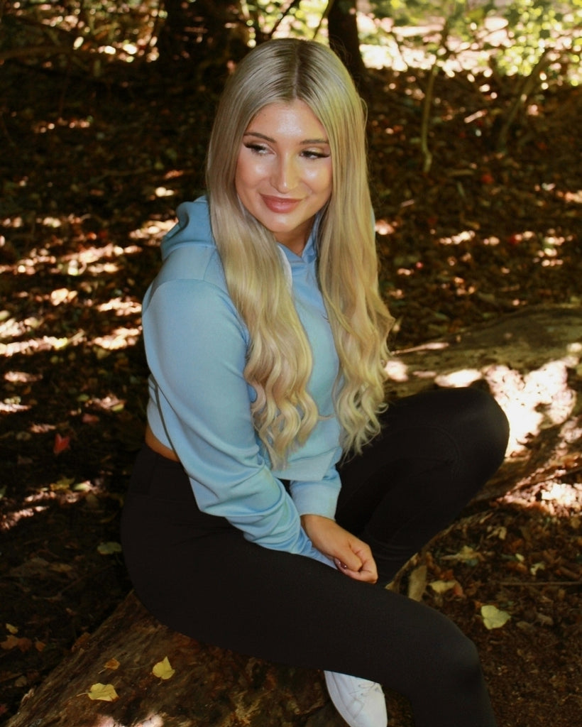 Blonde Model posing. Activewear. Blue Jumper. Leggings Tights. Bike Shorts